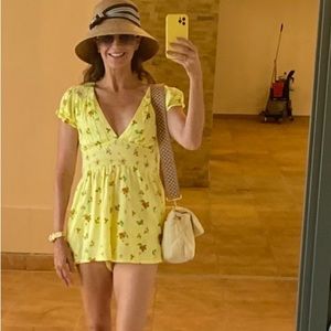 Sz S Yellow floral urban outfitters romper with open back and tie back neck